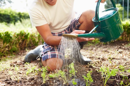 Worker wearing PPE during a landscaping waste removal job